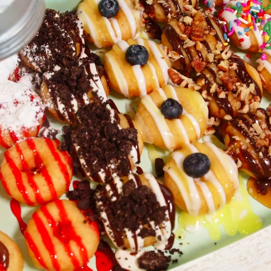 A finished tray of hot fresh doughnuts